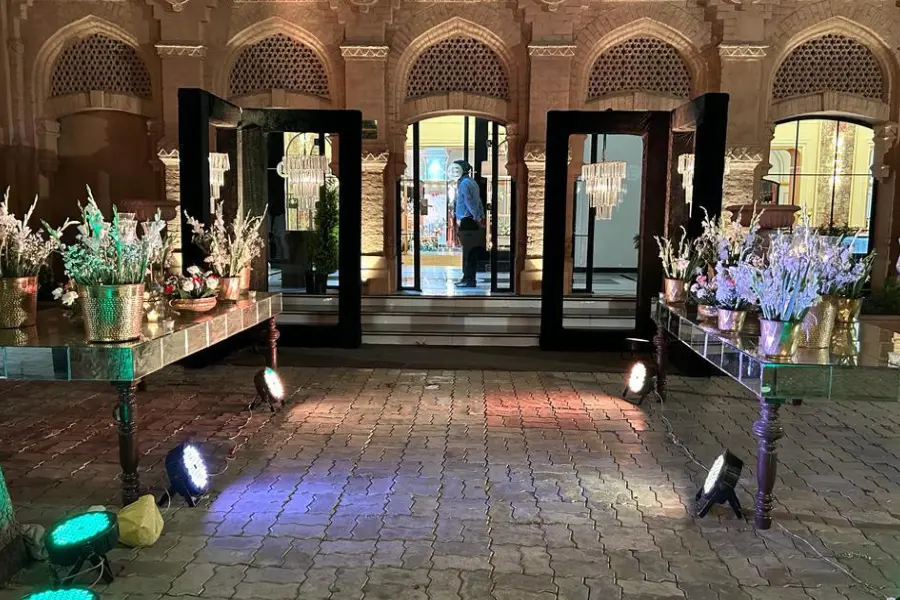 View of elegant floral decor and mirrored entrance setup at The Earth, Amritsar, welcoming guests with sophistication and charm.